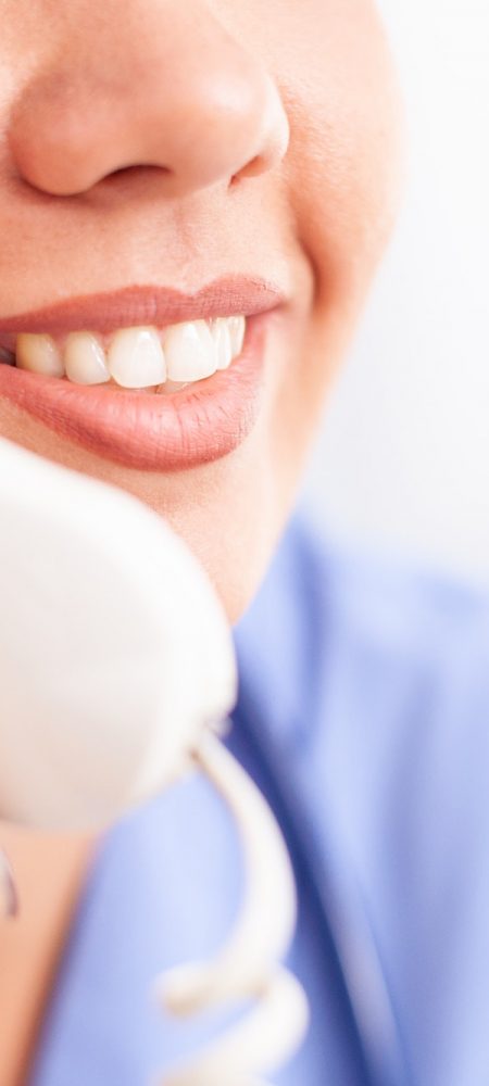 Woman nurse answering telephone